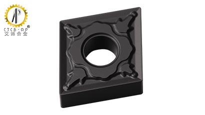 How does the chip-breaker design on carbide inserts impact the machining process
